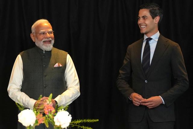 Indian Prime Minister Narendra Modi (L) and Netherlands' Prime Minister Rob Jetten react during an official visit of India's Prime Minister in The Hague on May 16, 2026. (Photo by Lina Selg / AFP)