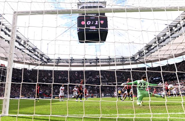 Stuttgart's Danish midfielder #28 Nikolas Nartey (C, hidden) scores the 0-2 goal against Frankfurt's German goalkeeper #23 Michael Zetterer (R) during the German first division Bundesliga football match between Eintracht Frankfurt and VfB Stuttgart in Frankfurt am Main, western Germany, on May 16, 2026. (Photo by Kirill KUDRYAVTSEV / AFP) / DFL REGULATIONS PROHIBIT ANY USE OF PHOTOGRAPHS AS IMAGE SEQUENCES AND/OR QUASI-VIDEO