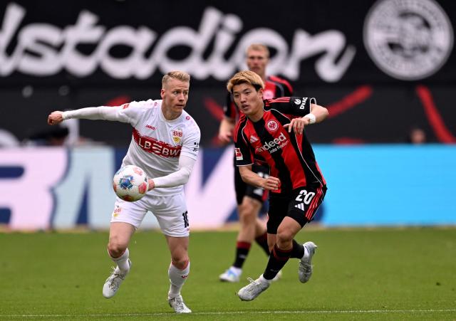 Stuttgart's German midfielder #10 Chris Fuehrich (L) and Frankfurt's Japanese forward #20 Ritsu Doan vie for the ball during the German first division Bundesliga football match between Eintracht Frankfurt and VfB Stuttgart in Frankfurt am Main, western Germany, on May 16, 2026. (Photo by Kirill KUDRYAVTSEV / AFP) / DFL REGULATIONS PROHIBIT ANY USE OF PHOTOGRAPHS AS IMAGE SEQUENCES AND/OR QUASI-VIDEO