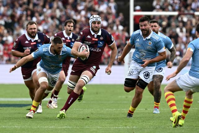 Bordeaux-Begles’ Australian flanker Lachlan Swinton runs with the ball during the French Top 14 rugby union match between Union Bordeaux-Begles (UBB) and USAP Perpignan at the Chaban-Delmas Stadium in Bordeaux, south-western France on May 16, 2026. (Photo by Philippe LOPEZ / AFP)