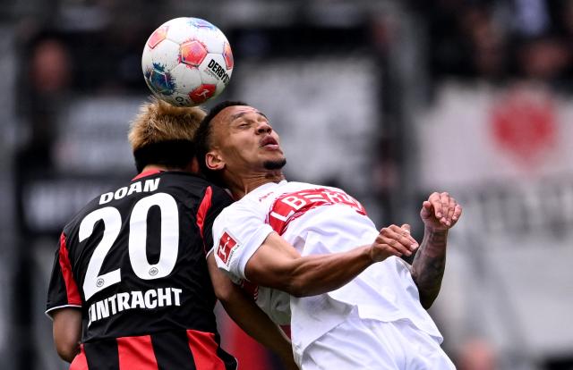 Frankfurt's Japanese forward #20 Ritsu Doan (L) and Stuttgart's Danish midfielder #28 Nikolas Nartey vie for the ball during the German first division Bundesliga football match between Eintracht Frankfurt and VfB Stuttgart in Frankfurt am Main, western Germany, on May 16, 2026. (Photo by Kirill KUDRYAVTSEV / AFP) / DFL REGULATIONS PROHIBIT ANY USE OF PHOTOGRAPHS AS IMAGE SEQUENCES AND/OR QUASI-VIDEO
