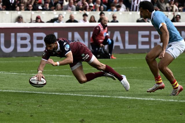 Bordeaux-Begles’ French full-back Romain Buros scores a try during the French Top 14 rugby union match between Union Bordeaux-Begles (UBB) and USAP Perpignan at the Chaban-Delmas Stadium in Bordeaux, south-western France on May 16, 2026. (Photo by Philippe LOPEZ / AFP)