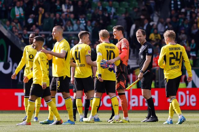 Dortmund's Brazilian defender #02 Yan Couto (2ndL) celebrates with his team mates after scoring his team's second goal 0:2 during the German first division Bundesliga football match between Werder Bremen and Borussia Dortmund in Bremen, northwestern Germany, on May 16, 2026. (Photo by Focke Strangmann / AFP) / DFL REGULATIONS PROHIBIT ANY USE OF PHOTOGRAPHS AS IMAGE SEQUENCES AND/OR QUASI-VIDEO