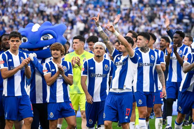 FC Porto's players react at the end of the Portuguese League football match between FC Porto and CD Santa Clara at the Dragao stadium in Porto on May 16, 2026. (Photo by Miguel RIOPA / AFP)