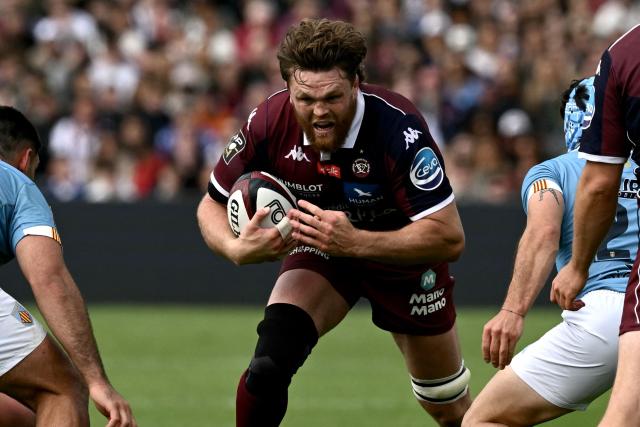Bordeaux-Begles' Australian lock Adam Coleman (C) runs with the ball during the French Top 14 rugby union match between Union Bordeaux-Begles (UBB) and USAP Perpignan at the Chaban-Delmas Stadium in Bordeaux, south-western France on May 16, 2026. (Photo by Philippe LOPEZ / AFP)