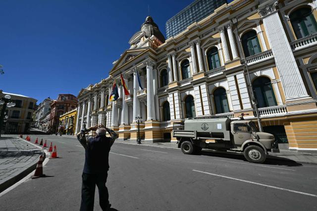 An armoured riot-control vehicle is parked outside the Legislative Palace in La Paz on May 16, 2026. Bolivia's government reached an agreement on May 15 with thousands of miners who clashed with police in a protest that paralysed downtown La Paz. However, other sectors continue to block access routes to the city, home to the executive branch and Congress. (Photo by AIZAR RALDES / AFP)