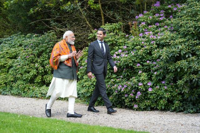 Indian Prime Minister Narendra Modi (L) and Netherlands' Prime Minister Rob Jetten speak together during an official visit of India's Prime Minister in The Hague on May 16, 2026. (Photo by Lina Selg / AFP)
