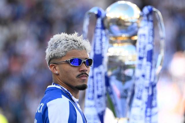 FC Porto's Brazilian forward #07 William Gomes walks in front of the Portuguese League trophy after the Portuguese League football match between FC Porto and CD Santa Clara at the Dragao stadium in Porto on May 16, 2026. (Photo by Miguel RIOPA / AFP)