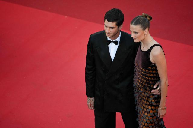 French bicycle rider Matthias Dandois and French model Constance Jablonski  arrive for the screening of the film "El ser querido" (The Beloved) at the 79th edition of the Cannes Film Festival in Cannes, southern France on May 16, 2026. (Photo by Olivier CHASSIGNOLE / AFP)