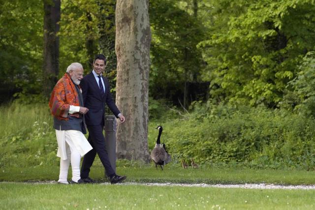 Indian Prime Minister Narendra Modi (L) and Dutch Prime Minister Rob Jetten (R) speak in the garden of the Catshuis during an official visit by India's Prime Minister to The Hague on May 16, 2026. (Photo by Lina Selg / AFP)