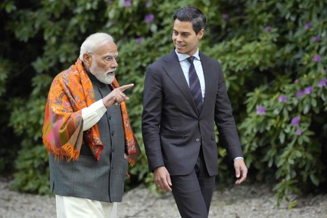 Indian Prime Minister Narendra Modi (L) and Dutch Prime Minister Rob Jetten (R) speak in the garden of the Catshuis during an official visit by India's Prime Minister to The Hague on May 16, 2026. (Photo by Lina Selg / AFP)