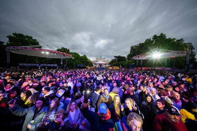 Fans celebrate in the fan area ahead the final of the Eurovision Song Contest 2026 (ESC) at Wiener Stadthalle in Vienna, Austria on May 16, 2026. (Photo by MAX SLOVENCIK / APA / AFP) / Austria OUT