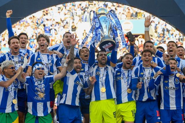 FC Porto players celebrate with the Portuguese League trophy after their Portuguese league match between FC Porto and CD Santa Clara at the Dragao stadium in Porto on May 16, 2026. (Photo by Miguel RIOPA / AFP)