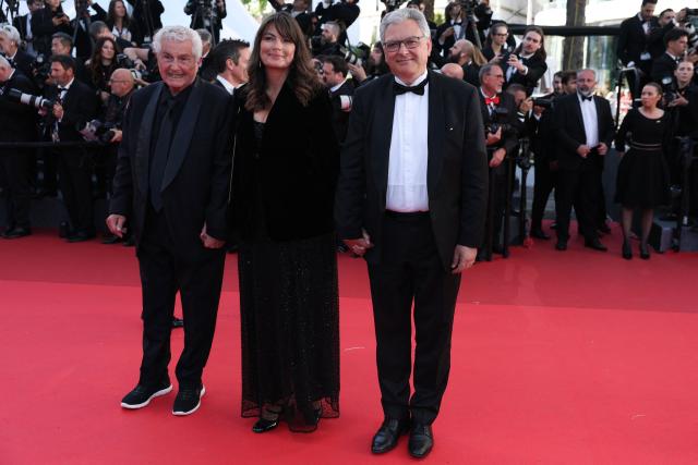 French director Claude Lelouch, French screenwriter Valerie Perrin and French producer Victor Hadida arrive for the screening of the film "El ser querido" (The Beloved) at the 79th edition of the Cannes Film Festival in Cannes, southern France on May 16, 2026. (Photo by Thibaud MORITZ / AFP)