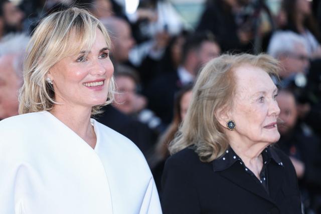 French director and screennwriter Judith Godreche (L) and French screenwriter Annie Ernaux arrive for the screening of the film "El ser querido" (The Beloved) at the 79th edition of the Cannes Film Festival in Cannes, southern France on May 16, 2026. (Photo by Sameer AL-DOUMY / AFP)