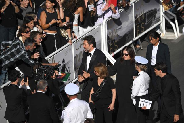 Spanish actor Javier Bardem signs autographs as he arrives for the screening of the film "El ser querido" (The Beloved) at the 79th edition of the Cannes Film Festival in Cannes, southern France on May 16, 2026. (Photo by Olivier CHASSIGNOLE / AFP)