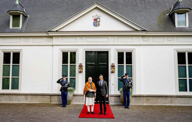 Indian Prime Minister Narendra Modi (L) and Dutch Prime Minister Rob pose ahead of their meeting at the Catshuis as part of an official visit by India's Prime Minister to The Hague on May 16, 2026. (Photo by Robin Utrecht / ANP / AFP) / Netherlands OUT