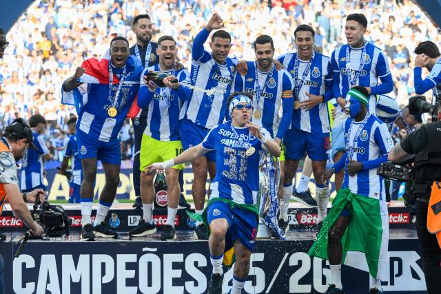 FC Porto's players celebrate winning the Portuguese League trophy after their Portuguese league match between FC Porto and CD Santa Clara at the Dragao stadium in Porto on May 16, 2026. (Photo by Miguel RIOPA / AFP)