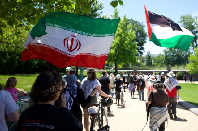 Demonstrators wave Palestinian and Iranian during a Nakba solidarity bike ride from Dupont Circle to the US Capitol in Washington, DC, on May 16, 2026, marking the 78th anniversary of the Nakba. (Photo by Amid FARAHI / AFP)