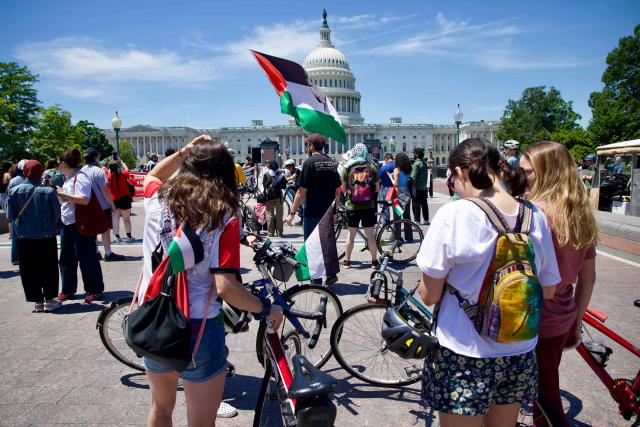 Demonstrators wave Palestinian flags as people gather near the US Capitol while participating in a Nakba solidarity bike ride from Dupont Circle to the US Capitol in Washington, DC, on May 16, 2026, marking the 78th anniversary of the Nakba. (Photo by Amid FARAHI / AFP)
