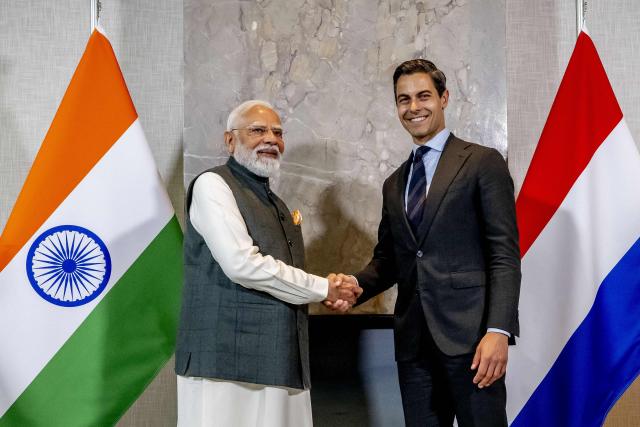 Indian Prime Minister Narendra Modi (L) and Dutch Prime Minister Rob Jetten pose ahead of their meeting at the Catshuis as part of an official visit by India's Prime Minister to The Hague on May 16, 2026. (Photo by Robin Utrecht / ANP / AFP) / Netherlands OUT