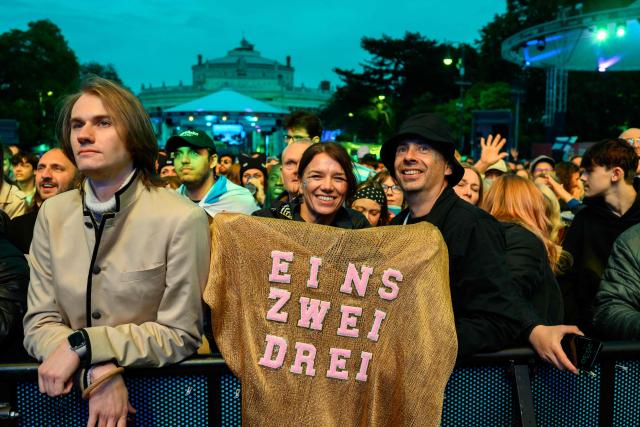 Fans celebrate in the fan area ahead the final of the Eurovision Song Contest 2026 (ESC) at Wiener Stadthalle in Vienna, Austria on May 16, 2026. (Photo by MAX SLOVENCIK / APA / AFP) / Austria OUT