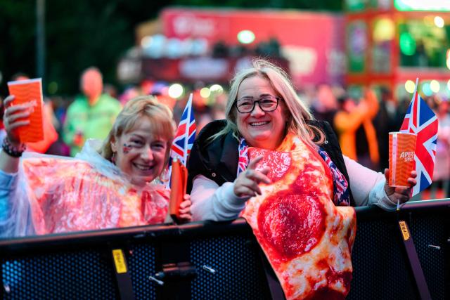 Fans celebrate in the fan area ahead the final of the Eurovision Song Contest 2026 (ESC) at Wiener Stadthalle in Vienna, Austria on May 16, 2026. (Photo by MAX SLOVENCIK / APA / AFP) / Austria OUT