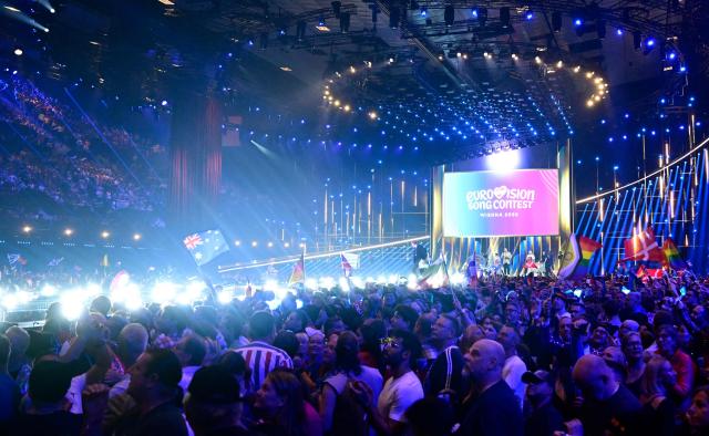 Spectators wait ahead the final of the Eurovision Song Contest 2026 (ESC) at Wiener Stadthalle in Vienna, Austria on May 16, 2026. (Photo by Tobias SCHWARZ / AFP)