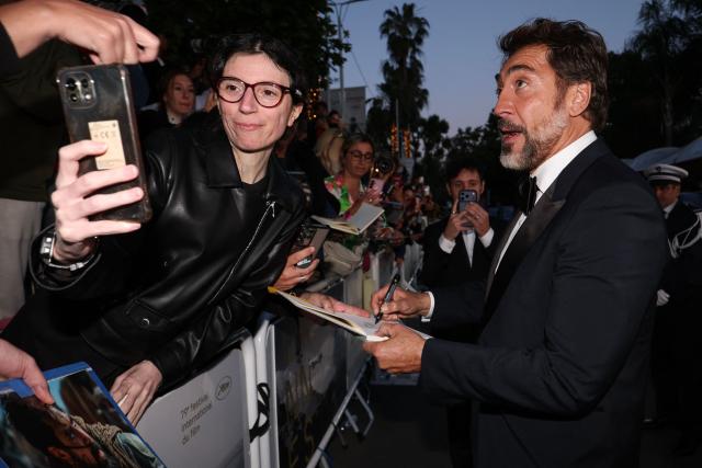 Spanish actor Javier Bardem signs autographs as he leaves after the screening of the film "El ser querido" (The Beloved) at the 79th edition of the Cannes Film Festival in Cannes, southern France on May 16, 2026. (Photo by Valery HACHE / AFP)