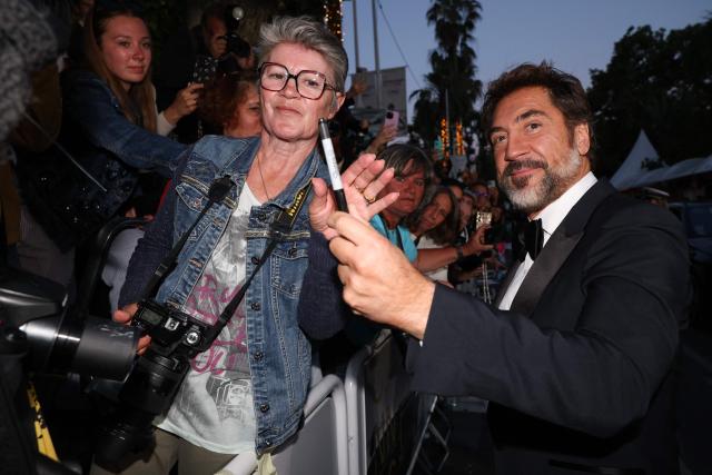Spanish actor Javier Bardem signs autographs as he leaves after the screening of the film "El ser querido" (The Beloved) at the 79th edition of the Cannes Film Festival in Cannes, southern France on May 16, 2026. (Photo by Valery HACHE / AFP)