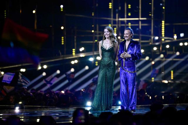 Austrian presenters Victoria Swarovski and Michael Ostrowski address the audience during the final of the Eurovision Song Contest 2026 (ESC) at Wiener Stadthalle in Vienna, Austria on May 16, 2026. (Photo by Tobias SCHWARZ / AFP)