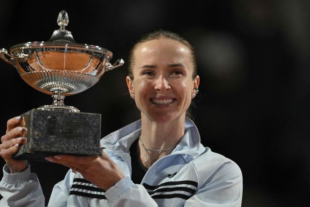 Ukraine's Elina Svitolina poses with the trophy after winning the WTA Rome Open tennis tournament final against USA's Coco Gauff at Foro Italico in Rome on May 16, 2026. (Photo by Tiziana FABI / AFP)