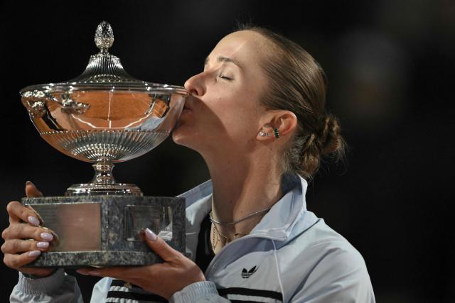 Ukraine's Elina Svitolina kisses the trophy after winning the WTA Rome Open tennis tournament final against USA's Coco Gauff at Foro Italico in Rome on May 16, 2026. (Photo by Tiziana FABI / AFP)