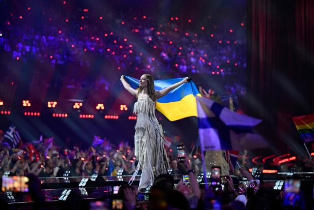 Ukraine's Leleka walks on stage with the country flag during the final of the Eurovision Song Contest 2026 (ESC) at Wiener Stadthalle in Vienna, Austria on May 16, 2026. (Photo by Tobias SCHWARZ / AFP)