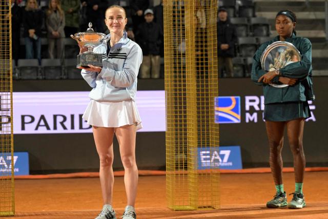 Ukraine's Elina Svitolina poses with the trophy after winning the WTA Rome Open tennis tournament final against USA's Coco Gauff at Foro Italico in Rome on May 16, 2026. (Photo by Tiziana FABI / AFP)