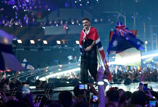Norwegian singer Jonas Lovv, representing Norway with the song 'Ya Ya Ya', arrives on stage for the final of the Eurovision Song Contest 2026 (ESC) at Wiener Stadthalle in Vienna, Austria on May 16, 2026. (Photo by Tobias SCHWARZ / AFP)