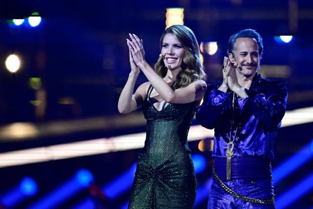 Austrian presenters Victoria Swarovski and Michael Ostrowski address the audience during the final of the Eurovision Song Contest 2026 (ESC) at Wiener Stadthalle in Vienna, Austria on May 16, 2026. (Photo by Tobias SCHWARZ / AFP)