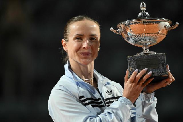 Ukraine's Elina Svitolina poses with the trophy after winning the WTA Rome Open tennis tournament final against USA's Coco Gauff at Foro Italico in Rome on May 16, 2026. (Photo by Tiziana FABI / AFP)