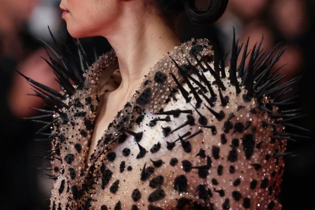 This photograph shows a close-up detail of the dress of Member of the jury Chinese director and screenwriter Chloe Zhao as she arrives for the screening of the film "Paper Tiger" at the 79th edition of the Cannes Film Festival in Cannes, southern France on May 16, 2026. (Photo by Thibaud MORITZ / AFP)