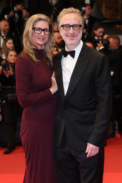 US director James Gray and his wife US producer and director Alexandra Dickson Gray arrive for the screening of the film "Paper Tiger" at the 79th edition of the Cannes Film Festival in Cannes, southern France on May 16, 2026. (Photo by Thibaud MORITZ / AFP)