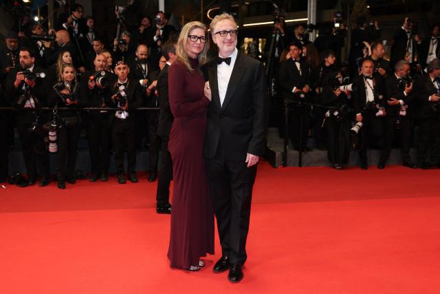 US director James Gray and his wife US producer and director Alexandra Dickson Gray arrive for the screening of the film "Paper Tiger" at the 79th edition of the Cannes Film Festival in Cannes, southern France on May 16, 2026. (Photo by Thibaud MORITZ / AFP)