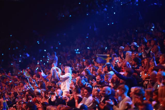 Spectators cheer during the final of the Eurovision Song Contest 2026 (ESC) at Wiener Stadthalle in Vienna, Austria on May 16, 2026. (Photo by Radek MICA / AFP)