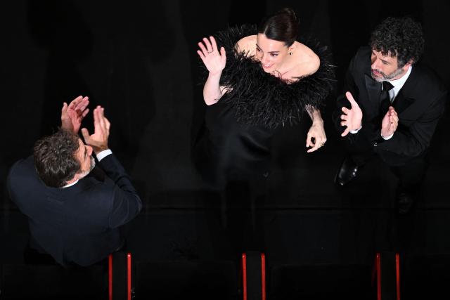 Spanish actor Javier Bardem, Spanish actress Victoria Luengo and Spanish film director Rodrigo Sorogoyen acknowledge the audience after the screening of the film "El ser querido" (The Beloved) at the 79th edition of the Cannes Film Festival in Cannes, southern France on May 16, 2026. (Photo by Antonin THUILLIER / AFP)