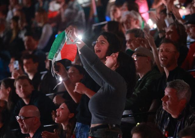 Supporters of Italy cheer during the final of the Eurovision Song Contest 2026 (ESC) at Wiener Stadthalle in Vienna, Austria on May 16, 2026. (Photo by Radek MICA / AFP)
