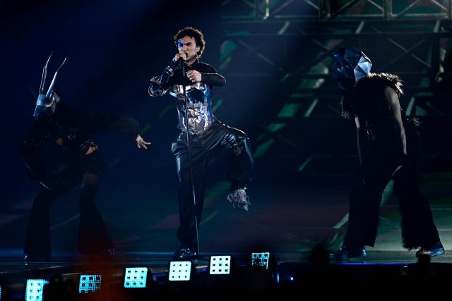 Austrian singer Benjamin Gedeon, aka Cosmo and representing Austria with the song 'Tanzschein', performs during the final of the Eurovision Song Contest 2026 (ESC) at Wiener Stadthalle in Vienna, Austria on May 16, 2026. (Photo by Tobias SCHWARZ / AFP)