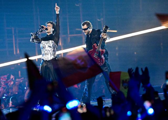 Austrian singer Benjamin Gedeon, aka Cosmo and representing Austria with the song 'Tanzschein', performs during the final of the Eurovision Song Contest 2026 (ESC) at Wiener Stadthalle in Vienna, Austria on May 16, 2026. (Photo by Tobias SCHWARZ / AFP)