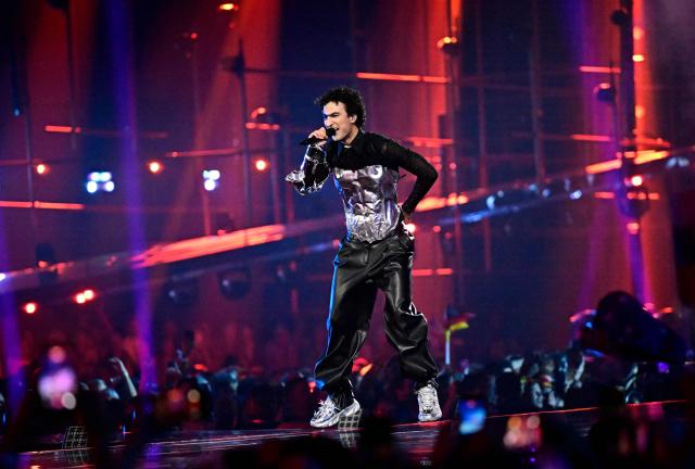 Austrian singer Benjamin Gedeon, aka Cosmo and representing Austria with the song 'Tanzschein', performs during the final of the Eurovision Song Contest 2026 (ESC) at Wiener Stadthalle in Vienna, Austria on May 16, 2026. (Photo by Tobias SCHWARZ / AFP)