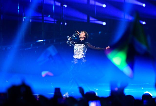 Austrian singer Benjamin Gedeon, aka Cosmo and representing Austria with the song 'Tanzschein', performs during the final of the Eurovision Song Contest 2026 (ESC) at Wiener Stadthalle in Vienna, Austria on May 16, 2026. (Photo by Tobias SCHWARZ / AFP)