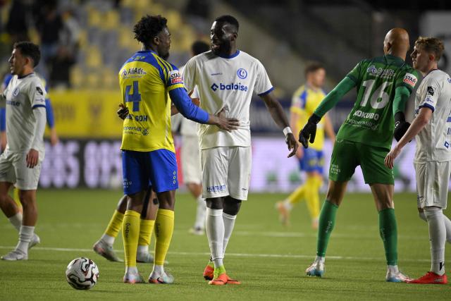 KAA Gent and STVV's players react at the end of the Belgian Pro League Champions' play-off (day 8 out of 10) football match between Sint-Truiden VV and KAA Gent in Sint-Truiden on May 16, 2026. (Photo by JOHN THYS / Belga / AFP) / Belgium OUT