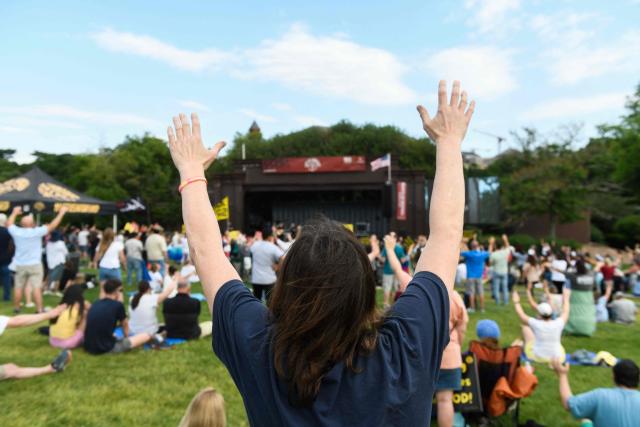Christian worshipers raise their hands as faith leaders pray during the Roots of Revival event at the Washington Monument, held a day ahead of "Rededicate 250: A National Jubilee of Prayer, Praise and Thanksgiving" in Washington, DC, on May 16, 2026. (Photo by Matthew Hatcher / AFP)